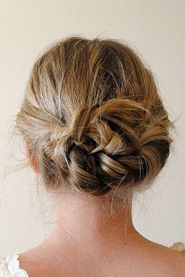 part hair down center. braid each pigtail back away from face. tie braids in a knot.-pin loose ends