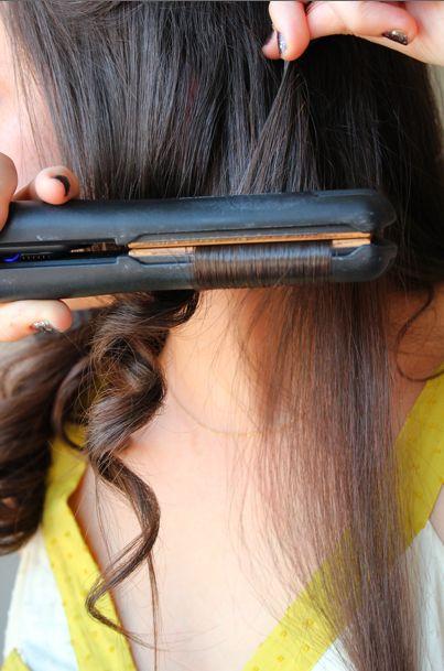curling your hair with a curling iron