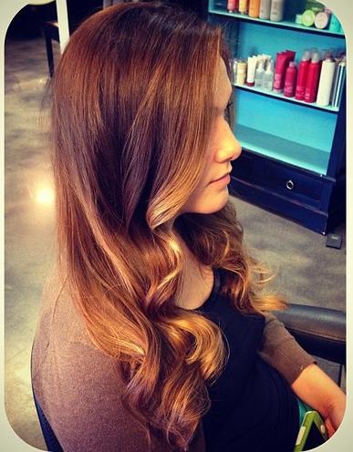 ombre highlights compliments her long wavy layers