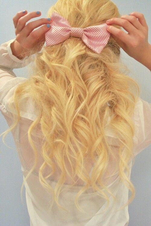 Curls half up half down with a bow