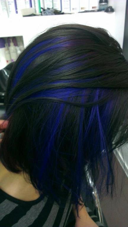 Black hair with blue peekaboo highlights.
