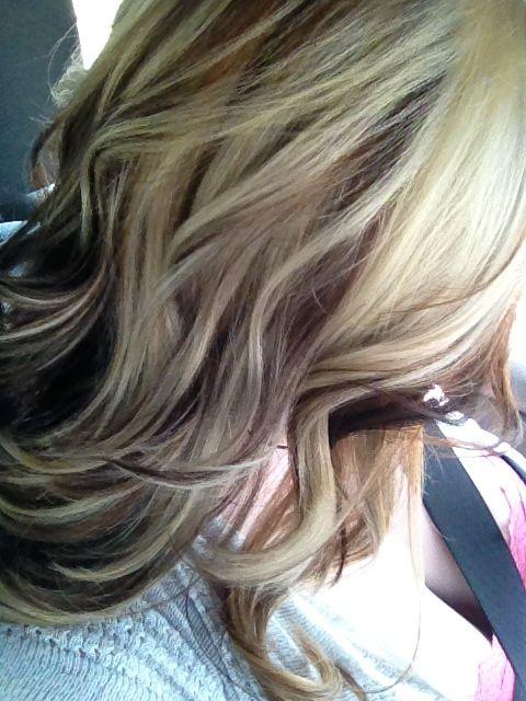 Blonde light brown and dark with a choppy cut