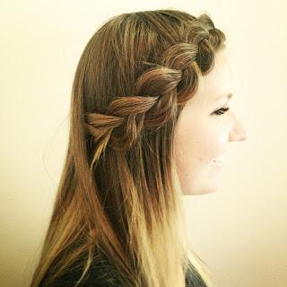 Deep side part and inverted braid.
