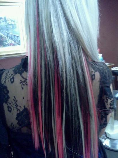Blonde hair with black and pink highlights