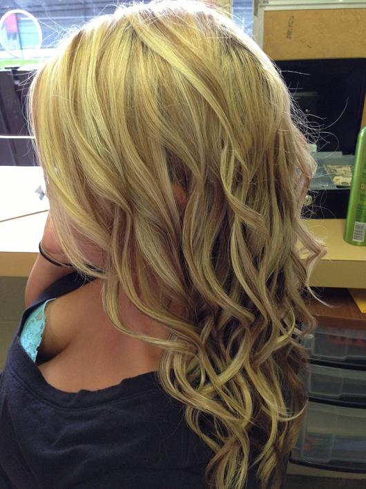 Warm blonde highlights and brown lowlights curled with a chi straightener